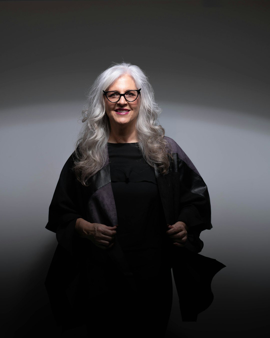Studio portrait of a senior Slovenian female producer and media educator