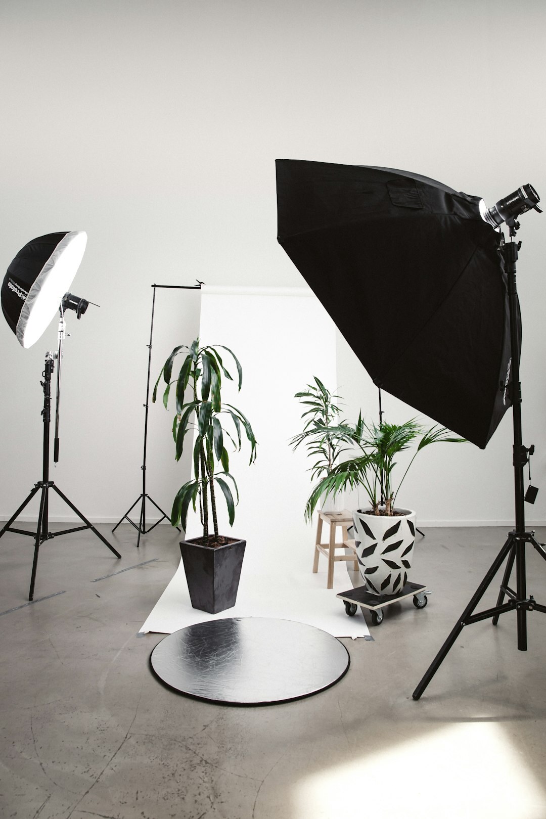 Professional video camera and studio lighting equipment in a media production room
